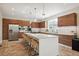 Modern kitchen with stainless steel appliances and large island at 147 Chapel Hill Cir, Brighton, CO 80601