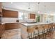 Modern kitchen with wood cabinets, large island, and stainless steel appliances at 147 Chapel Hill Cir, Brighton, CO 80601