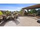 Outdoor patio with fireplace, seating area, and built-in grill at 147 Chapel Hill Cir, Brighton, CO 80601
