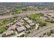 A beautiful community with many tan homes featuring tile roofs, green spaces, and easy access to the highway at 7160 S Wenatchee Way # F, Aurora, CO 80016