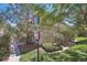 A stone-accented exterior with mature trees, shrubs, and a well-manicured lawn in a beautiful neighborhood at 7160 S Wenatchee Way # F, Aurora, CO 80016