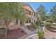 Charming exterior of a two-story home with stone accents, landscaped yard, and inviting entrance at 7160 S Wenatchee Way # F, Aurora, CO 80016