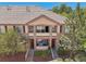 Charming tan two-story home with stone accents, a tile roof, and cozy balconies at 7160 S Wenatchee Way # F, Aurora, CO 80016