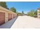 Row of garages at a property featuring brick accents and neutral siding at 7160 S Wenatchee Way # F, Aurora, CO 80016
