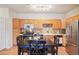 Bright kitchen with stainless steel appliances, plenty of cabinets, and a modern stove at 7160 S Wenatchee Way # F, Aurora, CO 80016