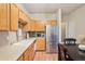 Well-appointed kitchen with stainless appliances, plenty of cabinet space, and a breakfast bar at 7160 S Wenatchee Way # F, Aurora, CO 80016