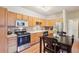 Well-equipped kitchen featuring stainless steel appliances, ample cabinet space, and an open layout at 7160 S Wenatchee Way # F, Aurora, CO 80016