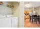 This is a laundry area with side-by-side washer and dryer at 7160 S Wenatchee Way # F, Aurora, CO 80016