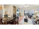 Bright living area with hardwood floors, a fireplace, access to the balcony, and a ceiling fan at 7160 S Wenatchee Way # F, Aurora, CO 80016