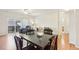 Inviting living area with hardwood floors, a sliding glass door, and ample seating at 7160 S Wenatchee Way # F, Aurora, CO 80016