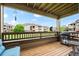 A covered balcony with outdoor seating offers views of the building at 12816 Ironstone Way # 203, Parker, CO 80134