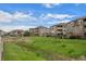Beautifully landscaped community with lush lawns and well-maintained apartment buildings at 12816 Ironstone Way # 203, Parker, CO 80134