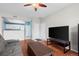 Bright living room with access to the kitchen and large windows at 12816 Ironstone Way # 203, Parker, CO 80134