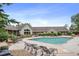Inviting community pool surrounded by lounge chairs and green space, perfect for relaxation at 12816 Ironstone Way # 203, Parker, CO 80134