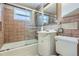 Bathroom featuring a tiled shower, a sink, a cabinet, and a toilet at 6260 W 45Th Pl, Wheat Ridge, CO 80033
