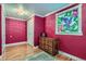 The bedroom features a stained glass window and traditional wood accents at 6260 W 45Th Pl, Wheat Ridge, CO 80033
