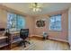 Bright bedroom with hardwood floors, large windows, and a modern art piece at 6260 W 45Th Pl, Wheat Ridge, CO 80033