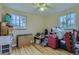 Bedroom featuring two windows, hardwood flooring, and ample room for storage at 6260 W 45Th Pl, Wheat Ridge, CO 80033