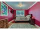 Bedroom featuring a window, a bed, wood floors, a rug and a modern ceiling light at 6260 W 45Th Pl, Wheat Ridge, CO 80033