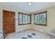 Welcoming foyer with tile flooring, a solid wood front door, and natural light streaming through the windows at 6260 W 45Th Pl, Wheat Ridge, CO 80033