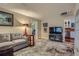 Comfortable living room with hardwood floors, a gray sofa, and a decorative rug at 6260 W 45Th Pl, Wheat Ridge, CO 80033