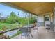 Charming covered patio with a pond and views of the serene backyard at 6260 W 45Th Pl, Wheat Ridge, CO 80033