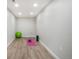 Finished basement area with vinyl plank flooring, ideal for a home gym at 875 Coal Bank Trl, Castle Rock, CO 80104