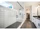 Bathroom featuring sleek glass shower with rainfall showerhead and large window to allow natural light at 875 Coal Bank Trl, Castle Rock, CO 80104