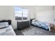 Shared bedroom featuring twin beds, soft carpet, and a window with a neighborhood view at 875 Coal Bank Trl, Castle Rock, CO 80104