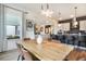 Dining room showing large windows with mountain views open to the kitchen at 875 Coal Bank Trl, Castle Rock, CO 80104