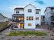 Back exterior showing patio, backyard landscaping, and modern architecture at 875 Coal Bank Trl, Castle Rock, CO 80104