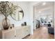 Bright foyer featuring hardwood floors, modern decor, and open access to the living room and stairway at 875 Coal Bank Trl, Castle Rock, CO 80104