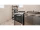 Spacious laundry room featuring modern stainless steel washer and dryer at 875 Coal Bank Trl, Castle Rock, CO 80104