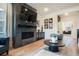 Inviting living room features a fireplace, decorative accents, and seamless flow to adjacent areas at 875 Coal Bank Trl, Castle Rock, CO 80104