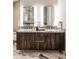 Sleek bathroom featuring a floating vanity with dual sinks and elegant marble accents at 4200 W 17Th Ave # 419, Denver, CO 80204