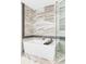 Modern bathroom features a stylish soaking tub with sleek fixtures and elegant tile work at 4200 W 17Th Ave # 419, Denver, CO 80204