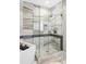 Modern walk-in shower with rainfall showerhead and designer tile work at 4200 W 17Th Ave # 419, Denver, CO 80204