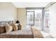 Serene bedroom with large window, stylish bedding, and plenty of natural light at 4200 W 17Th Ave # 419, Denver, CO 80204