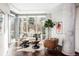 Bright living room with floor-to-ceiling windows, hardwood floors, modern furniture and a decorative houseplant at 4200 W 17Th Ave # 419, Denver, CO 80204