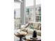 Bright living room with large windows, cozy sofa, and stylish decor offers a comfortable living space at 4200 W 17Th Ave # 419, Denver, CO 80204