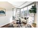 Bright living room featuring hardwood floors, floor-to-ceiling windows, comfortable seating, and modern decor at 4200 W 17Th Ave # 419, Denver, CO 80204