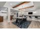 Spacious finished basement featuring an air hockey table, bar and TV area at 9380 Bear River St, Littleton, CO 80125