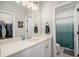Bright bathroom with granite countertop and shower at 9380 Bear River St, Littleton, CO 80125