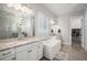 Bright bathroom features double vanity, soaking tub, walk-in closet, and granite countertops at 9380 Bear River St, Littleton, CO 80125