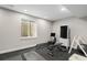 Basement home gym featuring workout equipment and large window for natural light at 9380 Bear River St, Littleton, CO 80125
