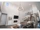 Bright and airy living room with a stone fireplace and open staircase to the upper level at 9380 Bear River St, Littleton, CO 80125