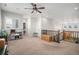 Upper level loft space with neutral colors, carpeted floor, and wood railing at 9380 Bear River St, Littleton, CO 80125