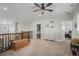 Bright loft area with wood railing, storage and ceiling fan at 9380 Bear River St, Littleton, CO 80125