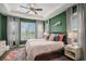 Spacious main bedroom featuring large windows, tray ceilings, and an en-suite bathroom at 9380 Bear River St, Littleton, CO 80125