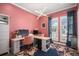 Home office featuring modern lighting, built-in shelving, desk, and bright window views at 9380 Bear River St, Littleton, CO 80125